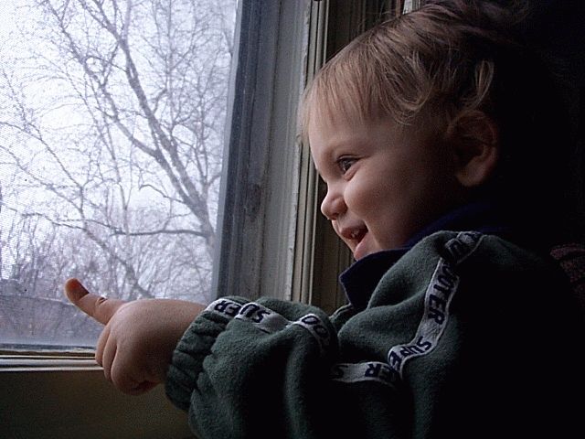 Owen smiling by the window