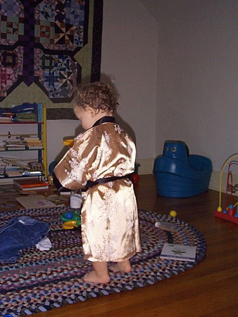 Owen in his robe from behind.