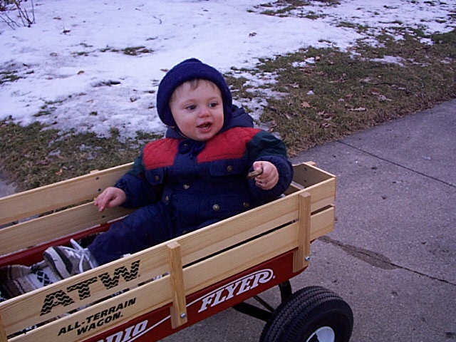 Owen riding in his wagon