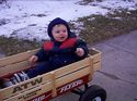 Owen riding in his wagon