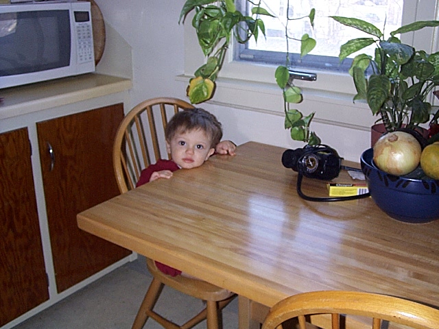 owen sitting at the table like a big boy