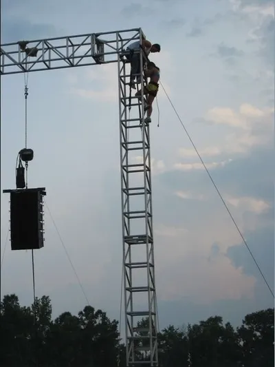 Woman on Lighting Rig
