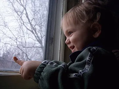 Owen smiling by the window