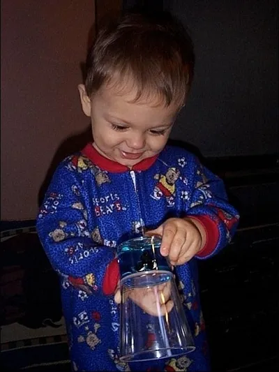 Owen looking at his new cup.