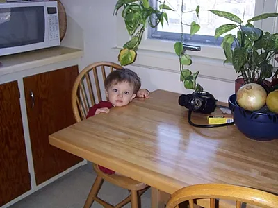 owen sitting at the table like a big boy